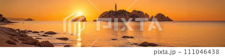 Orange sky and lighthouse on the horizon 111046438