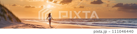 Sunset stroll: woman walking on beach 111046440