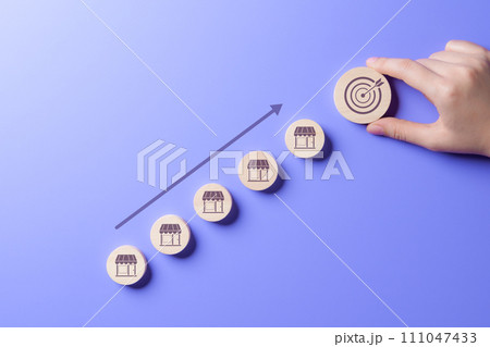 Business achievement goal and objective target concept. owner business startup profit earning, goal successful franchise store. Future forecasts for best product and store. hand putting round wooden. Business achievement goal and objective target concept. owner business startup profit earning, goal successful franchise store. Future forecasts for best product and store. hand putting round wooden. 111047433