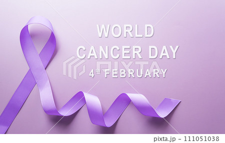 Purple ribbon on pastel paper background for supporting World Cancer Day campaign on February 4. 111051038