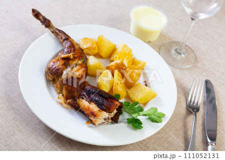 Grilled rabbit served in the plate 111052131