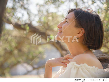 Beautiful Asian young woman in white dress outdoor Beautiful Asian young woman in white dress outdoor 111054810