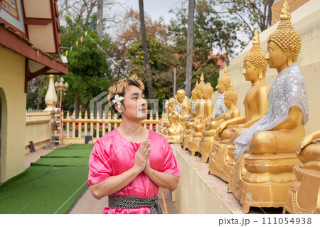 Songkran Day, young man wear Thai clothes and celebrate on Songkran Day. Songkran Day, young man wear Thai clothes and celebrate on Songkran Day. 111054938