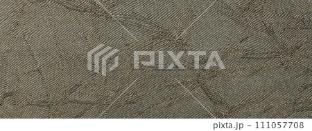 Texture of dark brown color background from textile material with wicker pattern, macro. Vintage umber fabric 111057708