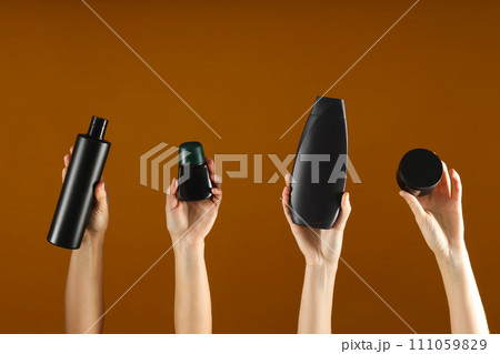 Hygiene products in the hands of women, on a bright background. 111059829