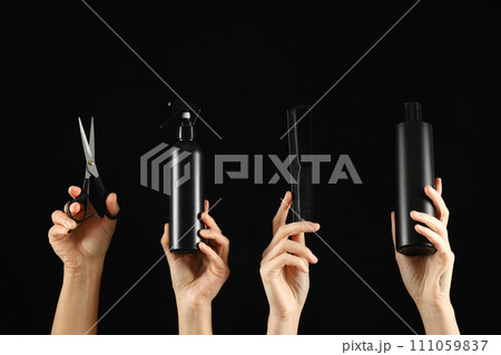 Hairdressing tools and products in female hands. 111059837