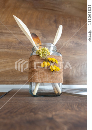 set of kitchen spatulas in the interior of the kitchen 111061831