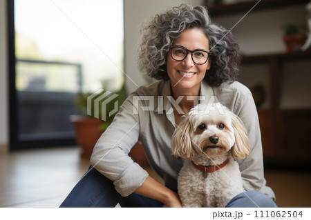 A Cheerful retired senior woman with dog and enjoying time with pet at home 111062504