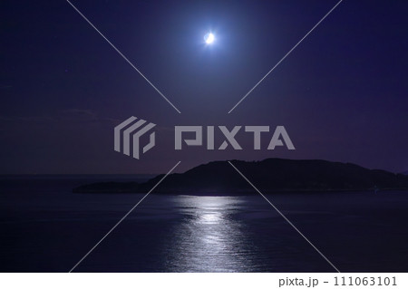 Moon in the dark sky over the island and sea 111063101