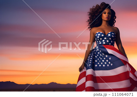 Black woman in a dress with an American flag on the edge at sunset. US Independence Day. Black woman in a dress with an American flag on the edge at sunset. US Independence Day. 111064071
