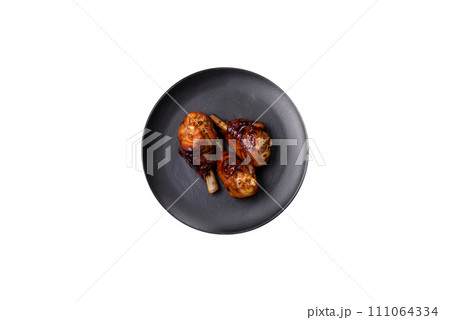 Delicious grilled chicken legs with spices and herbs in teriyaki sauce 111064334