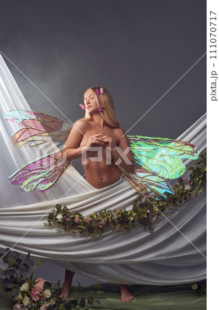 Nude woman with magic wings in studio 111070717