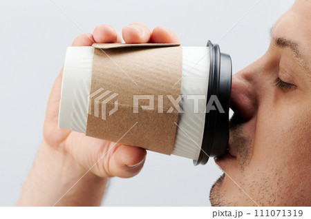 Man drink from paper cup 111071319