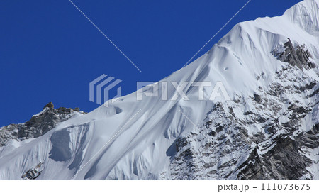 Detail of a snow covered glacier and peak near Gorak Shep, Nepal. Detail of a snow covered glacier and peak near Gorak Shep, Nepal. 111073675