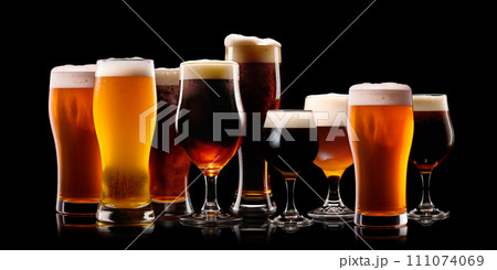 Set of Beer glasses on a black background. Mugs with drink like Ipa, Pale Ale, Pilsner, Porter or Stout 111074069