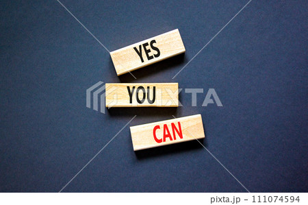 Motivational and Yes you can symbol. Concept words Yes you can on beautiful wooden blocks. Beautiful black table black background. Business motivational and Yes you can concept. Copy space. Motivational and Yes you can symbol. Concept words Yes you can on beautiful wooden blocks. Beautiful black table black background. Business motivational and Yes you can concept. Copy space. 111074594
