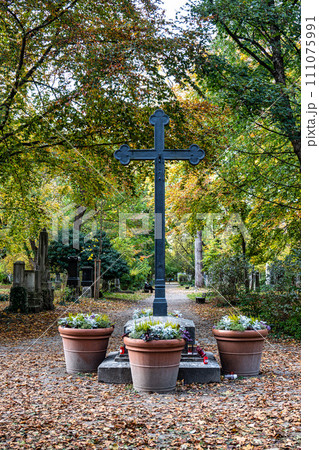 Autumn view of famous Old North Cemetery of Munich, Germany with historic gravestones. Autumn view of famous Old North Cemetery of Munich, Germany with historic gravestones. 111075991