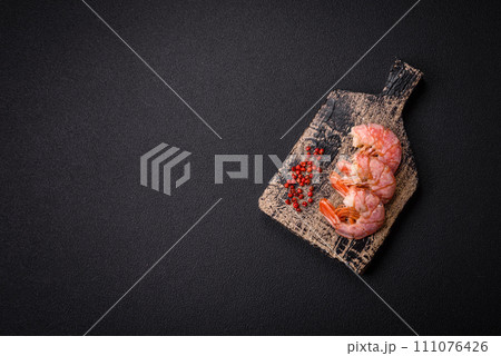 Delicious shrimp or langoustine tails boiled with salt and spices Delicious shrimp or langoustine tails boiled with salt and spices 111076426