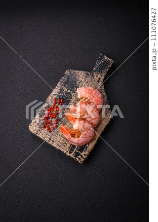 Delicious shrimp or langoustine tails boiled with salt and spices Delicious shrimp or langoustine tails boiled with salt and spices 111076427
