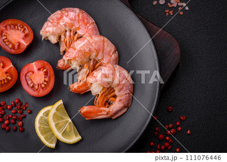 Delicious shrimp or langoustine tails boiled with salt and spices Delicious shrimp or langoustine tails boiled with salt and spices 111076446