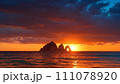 Island silhouette at sunset 111078920