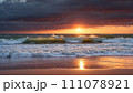 Cloudy sunset: coastal tranquility 111078921