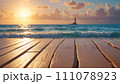 Lighthouse view: wooden boardwalk and ocean 111078923