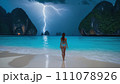 Night ocean scenery: girl and lightning 111078926