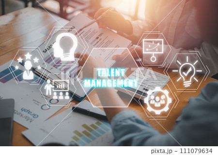Talent management concept, Business team analyzing income charts and graphs on office desk with talent management icon on virtual screen. Engagement, Ability, Efficiency, Aspiration, Potential. Talent management concept, Business team analyzing income charts and graphs on office desk with talent management icon on virtual screen. Engagement, Ability, Efficiency, Aspiration, Potential. 111079634