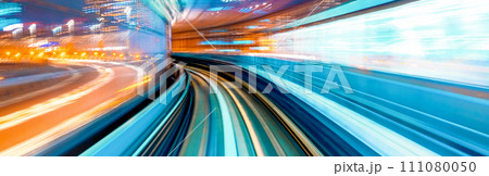Abstract high speed motion blurred concept image from a monorail in Tokyo, Japan 111080050