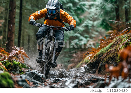 Athlete biking in the mountains 111080480