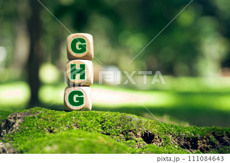 Business concept and GHG greenhouse gas symbol. Use the word GHG Greenhouse Gas on cubes and blocks. Business concept and GHG greenhouse gas symbol. Use the word GHG Greenhouse Gas on cubes and blocks. 111084643