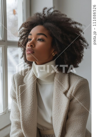 beautiful african woman wearing a white wool coat beautiful african woman wearing a white wool coat 111086526