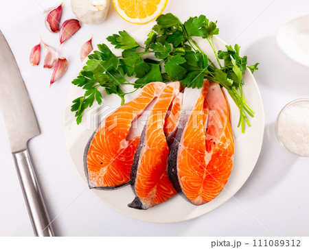 Fresh sliced steaks of salmon Fresh sliced steaks of salmon 111089312