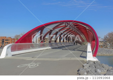 Calgary, Alberta, Canada. Jul 10, 2023. Inside view to the Peace Bridge that accommodates people walking and cycling across the Bow River. Calgary, Alberta, Canada. Jul 10, 2023. Inside view to the Peace Bridge that accommodates people walking and cycling across the Bow River. 111091068