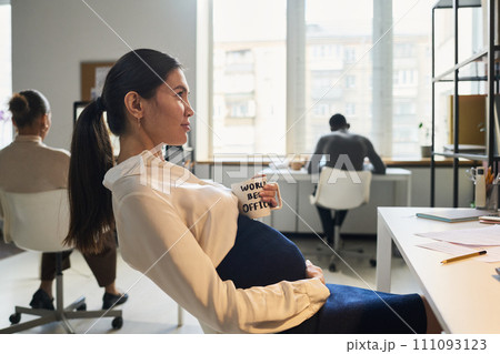 Young bored pregnant businesswoman Young bored pregnant businesswoman 111093123