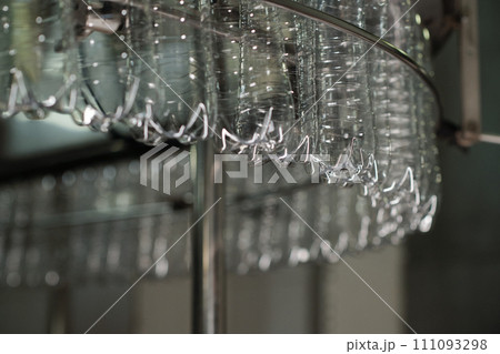 Clean bottles rotating in assembly line Clean bottles rotating in assembly line 111093298