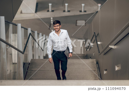 Young stylish man looking confident and contented 111094070