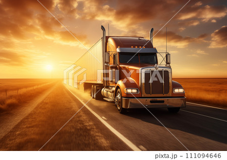 Cargo van drives along the highway against the backdrop of a field and sunset sky. Front view 111094646