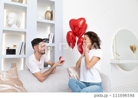 Man makes a proposal at the Valentines day celebration 111096598