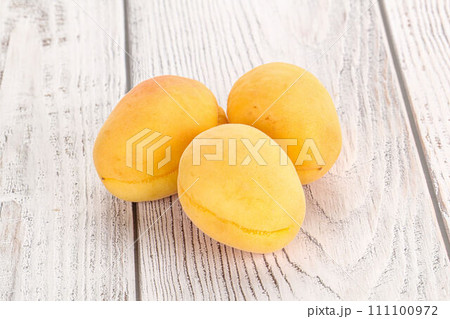 Ripe sweet juicy apricot heap 111100972