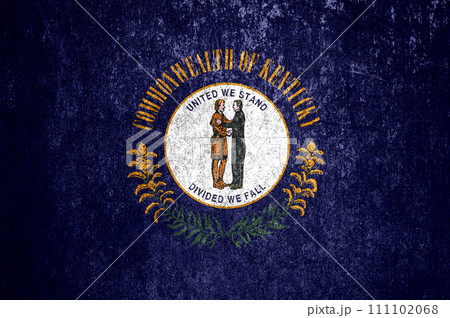 Close-up of the Kentucky grunge state flag. Dirty Kentucky state flag on a metal surface. 111102068