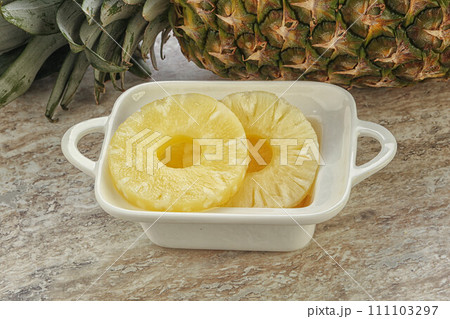Marinated pineapple rings in the bowl Marinated pineapple rings in the bowl 111103297