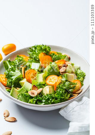 Kumquat salad with avocado and nuts. Kumquat salad with avocado and nuts. 111103389