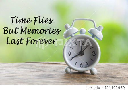 Time flies but memories last forever quote with alarm clock pointing at 8 am. Motivational concepts. 111103989
