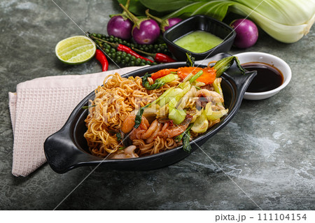 Asian cuisine - Fried noodles with seafood 111104154