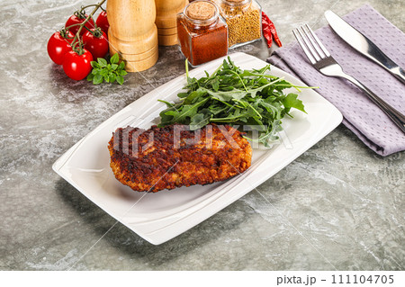 Tasty roasted breaded meat schnitzel 111104705