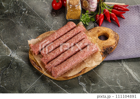 Raw beef kebab sausage for grill Raw beef kebab sausage for grill 111104891