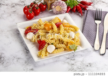 Italian pasta with mozzarella and tomato Italian pasta with mozzarella and tomato 111104893