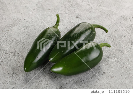 Raw green Mexican jalapeno pepper Raw green Mexican jalapeno pepper 111105510